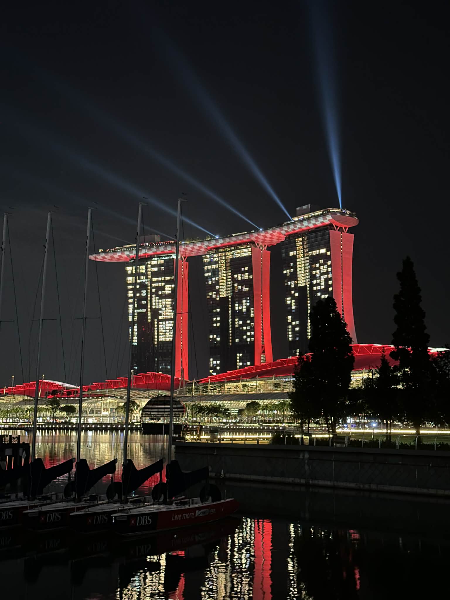 Marina Bay Sands hotel and Singapore skyline illuminated against the night sky